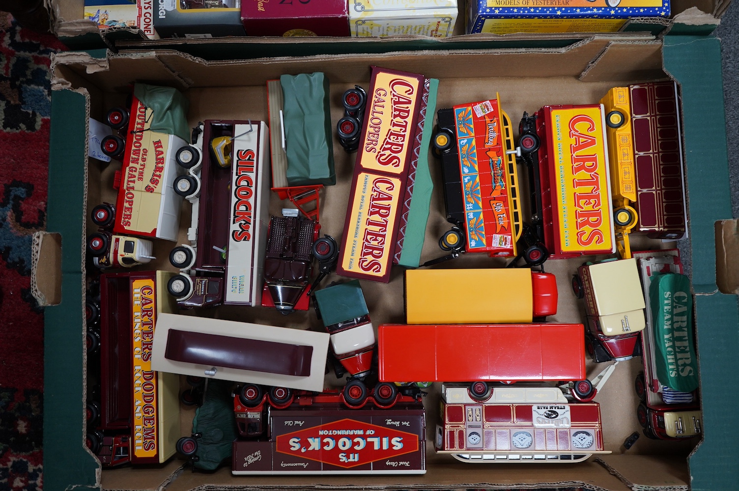 A collection of fairground related vehicles by Corgi, Matchbox, etc. including ten boxed examples; a Garrett Showman’s Tractor (CC20301), a Models of Yesteryear Fowler (Y-9), a Burrell Showman’s Steam Wagon and cardboard